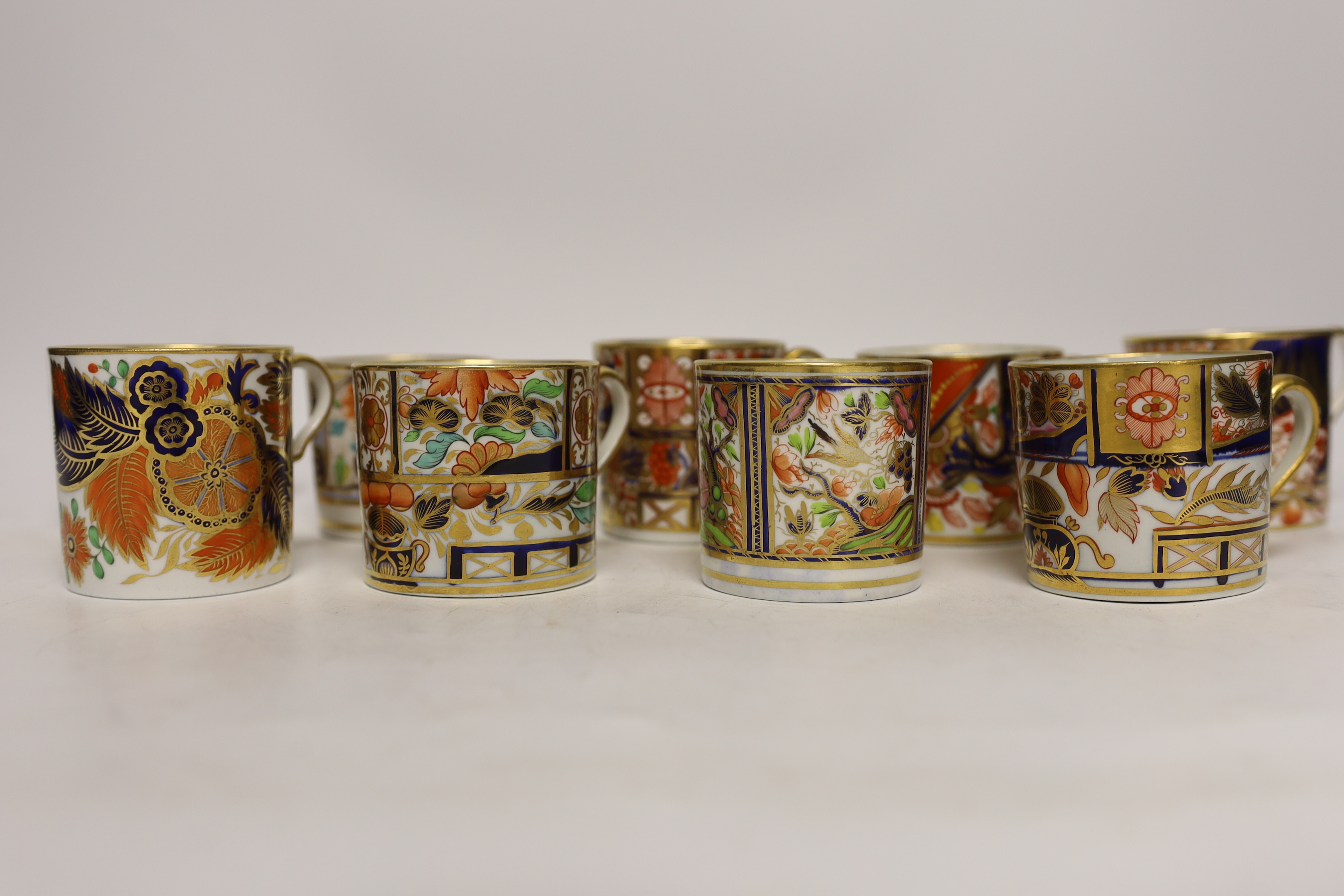 Twelve 1800-1820 English Imari style patterned coffee cans